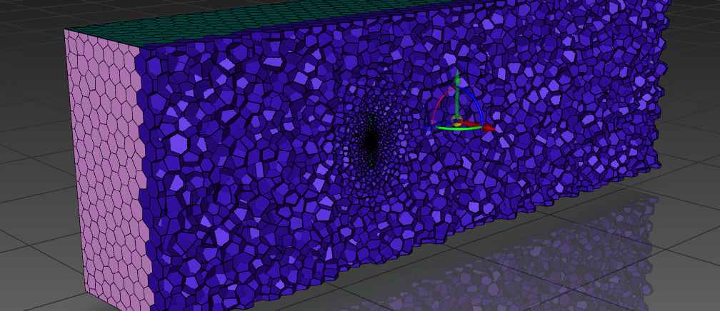 The polyhedral mesh of the rotating zone around the rotor, sliced lengthwise, cells refining toward the blades