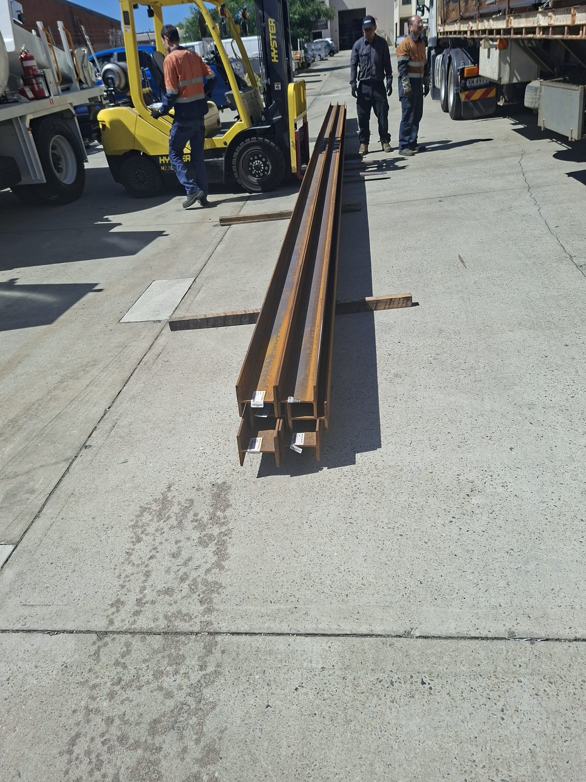 A delivery of universal steel beams on the workshop floor