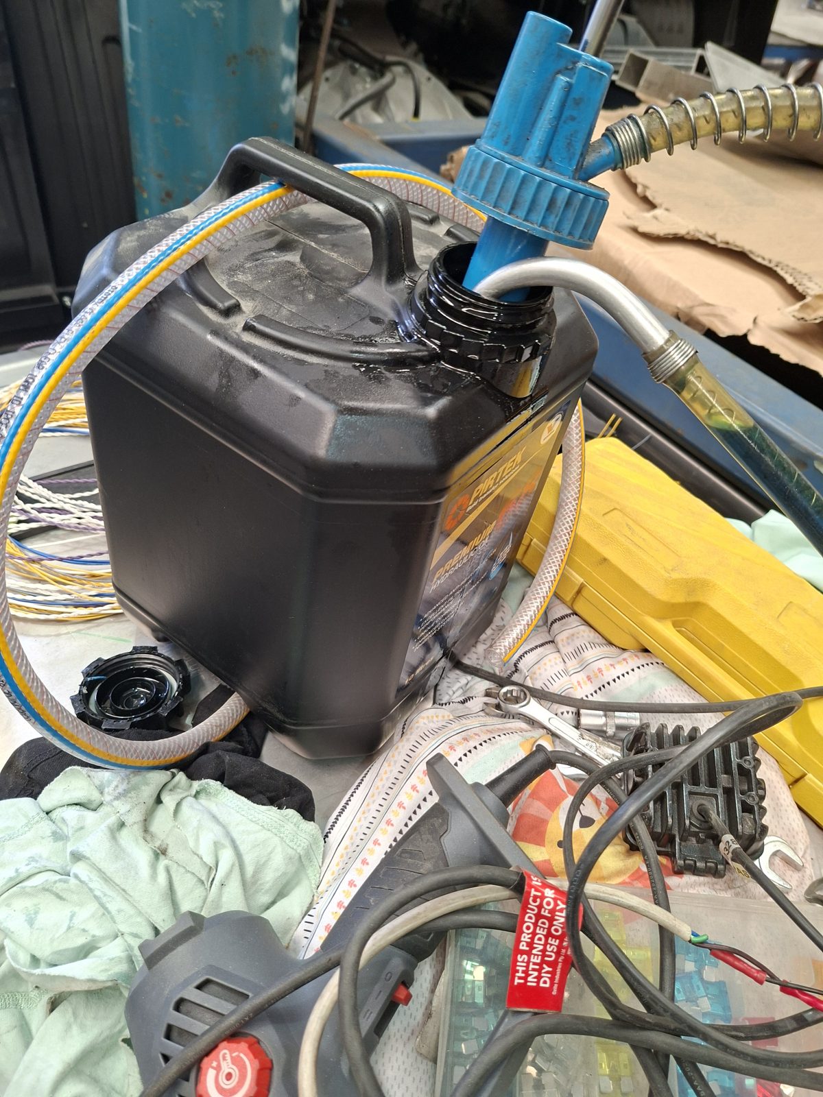 Hydraulic fluid being pumped into the hydraulic pump reservoir